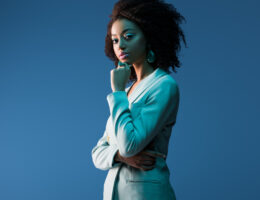 confident young black woman professional in a blue suite