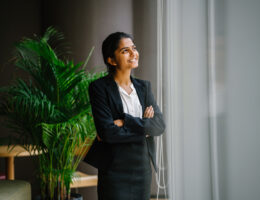 Portrait of young businesswoman standing and smiling