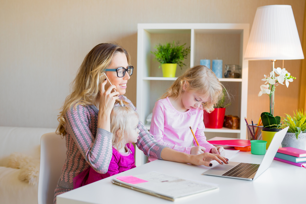 working mom at home with young daughters